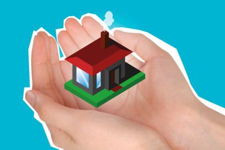 Debt Estate Planning - Cutout paper composition with house in handful showing concept of buying private apartment against blue background