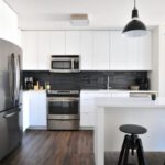 Property Value - gray steel 3-door refrigerator near modular kitchen
